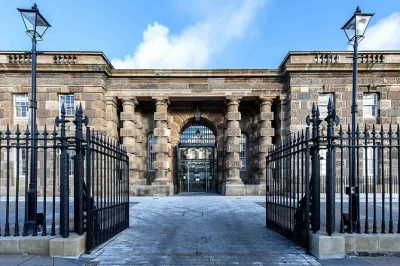 Hear belfast’s stories on a black taxi murals tour and explore crumlin road gaol with entry included. local guides, private transport, and real city history.