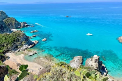 Feel the sea breeze on a tropea to capo vaticano boat tour—swim in hidden bays, snorkel with fish, enjoy local wine & snacks. includes guide & gear.
