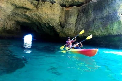 Feel the algarve’s sea breeze on a benagil kayak tour with catamaran support, local guides, and time to swim or relax—includes all gear and easy boarding.