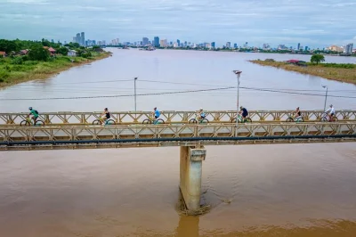 Feel the morning buzz of phnom penh, cycle quiet roads to silk island, watch local silk weaving, and enjoy snacks—includes hotel pickup and english-speaking guide.