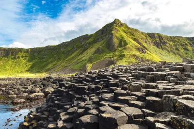 Early departure from belfast port for giants causeway, dunluce castle, and antrim coast road with a local guide. includes port pickup and live commentary.