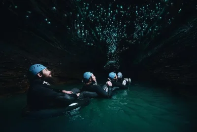 Feel the rush of black water rafting in waitomo’s ruakuri cave, float beneath glowworms, jump waterfalls, and warm up with soup after—all gear included.