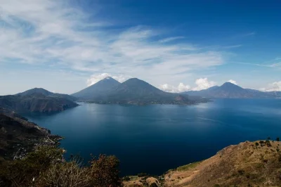 Wake up early for a lake atitlan day tour from antigua, with private transport, local mayan guide, boat ride to villages, and time for lakeside coffee breaks.
