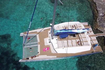 Sail malta’s coast on a spacious catamaran, swim in the blue lagoon’s turquoise water, and lounge on nets with music. includes sunbeds, snorkeling stops, and adult-only atmosphere.