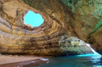 Feel the sea spray on a 2-hour benagil caves boat tour from portimão, with local guide stories, photo stops, and a swim at praia da marinha. includes guide.