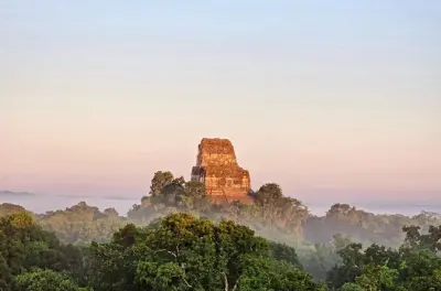 Tikal Sunset Tour from Flores: Pyramid views at golden hour