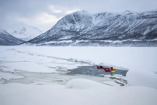 Arctic Ocean floating in Tromsø: Immersion suits & campfire
