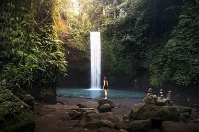 Swim with tropical fish at blue lagoon, explore kanto lampo & tibumana waterfalls, and enjoy lunch in padangbai—private tour with hotel pickup included.