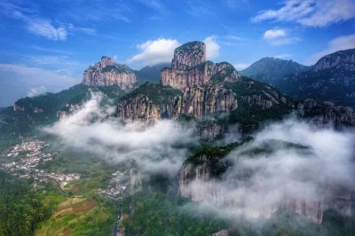 Feel the cool mist at dragon waterfall, walk the yandang glass bridge, and see lingfeng’s night glow on this private day trip from wenzhou—includes hotel pickup and lunch.