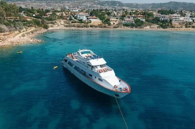 Feel the mediterranean breeze on a relaxed adults-only yacht cruise from paphos, with swim stops, buffet lunch, open bar, and hotel pickup included for easy booking.