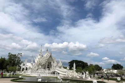 Step inside chiang rai’s white temple, blue temple, and red chinese temple on a private day trip from chiang mai with lunch, entry tickets, and hotel pickup included.