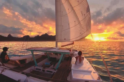 Feel the breeze on moorea’s north coast aboard taboo catamaran, sip a maitai at sunset, and sail past cook’s bay—includes drinks and local guide.