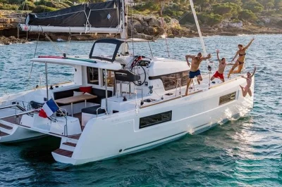 Feel the sea breeze on a luxury catamaran in sardinia’s maddalena archipelago, with stops for swimming, a sardinian lunch, local wine, and pickup from palau.
