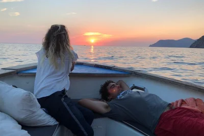 Feel the colors of cinque terre at sunset from a boat, swim in hidden coves, and share a generous italian aperitivo. includes drinks, snacks, and snorkeling gear.