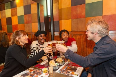 Meet new friends on a brussels food tour through marolles & sablon, tasting shrimp croquettes, boulettes à la gueuze, local beer, waffles & chocolate. includes drinks.