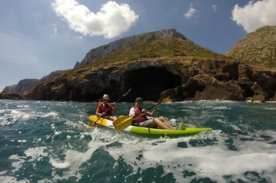 Paddle from denia to cova tallada, explore the cave by lantern, and snorkel in cap de sant antoni’s clear waters. includes equipment, snack, and certified local guide.