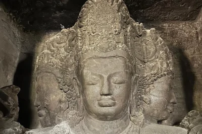 Step onto elephanta island by ferry from mumbai, wander ancient caves with a local guide, and see the trimurti up close. includes all entry fees and bottled water.