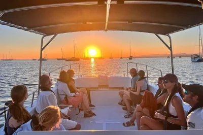 Watch the sunset over ria formosa from a boat, taste fresh clams on culatra island, and enjoy private transport with a local guide—includes water and info guides.
