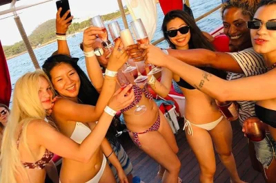 Feel the ibiza sunset on a small group boat tour with paddle boards, kayaks, and snorkeling. includes drinks, tapas, and pickup from san antonio port.