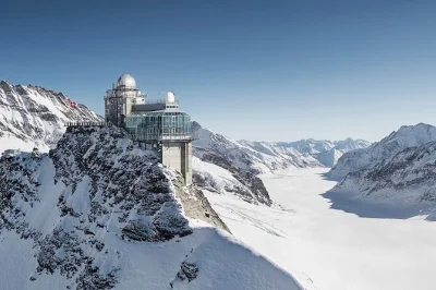 Feel the thrill of jungfraujoch’s snowy heights on a day trip from interlaken, with eiger express cable car, sphinx observatory, and ice palace. includes guide & transport.