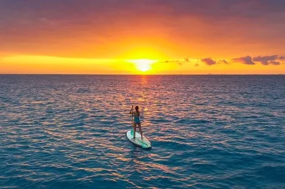Start your morning gliding on the caribbean sea in playa del carmen with a sunrise paddleboard tour, guided session, photos included, and beach club perks.