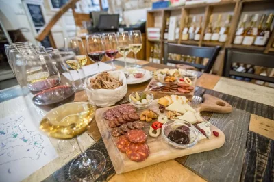 Sip five hungarian wines in budapest with a sommelier, paired with artisan cheese, charcuterie, and fresh bread. includes tasting sheets and regional wine map.