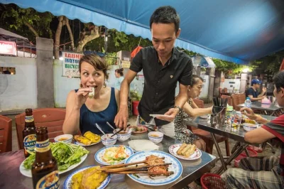 Follow a small-group street food tour through hoi an old town at sunset, tasting banh mi, bbq pork rolls, cao lau noodles & local sweets. includes guide & drinks.