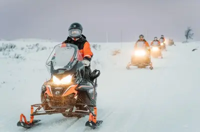 Snowmobile and ice fishing in Alta: Arctic wilderness