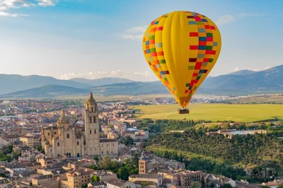 Float above segovia at sunrise in a hot-air balloon, see the roman aqueduct & alcázar, and enjoy brunch with cava. includes optional madrid hotel pickup.