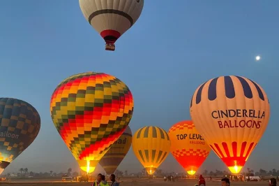 Float above luxor at sunrise on a hot air balloon ride, see ancient temples and the nile from the sky, includes hotel pickup and light breakfast before flight.