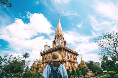Wander phuket’s old town, taste hokkien noodles at a michelin spot, visit chalong temple & big buddha, and relax with all transfers included in a comfy van.