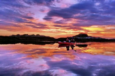 Kayak under the midnight sun in lofoten, paddle past islands with a local guide, hear viking stories, and share homemade tea. evening departures, snacks included.