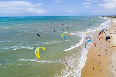 Feel the wind on a cumbuco beach day trip from fortaleza. ride dunes, taste fresh seafood, and relax by the lagoon with pickup and local guide included.