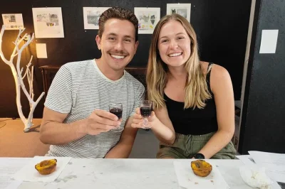 Feel the warmth of porto baking pastel de nata, sipping local wine, and learning in a cozy workshop near sé do porto. includes all ingredients and drinks.