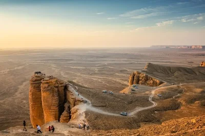 Feel the desert wind at edge of the world near riyadh, ride camels, explore a 150-year-old bat cave, and share a traditional dinner—includes pickup and guide.