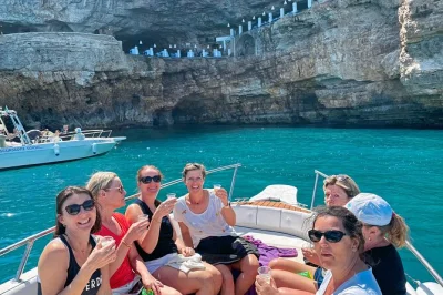 Start your polignano a mare boat trip with local guides, explore hidden sea caves, swim in turquoise water, and relax on modern boats. includes swimming stop.
