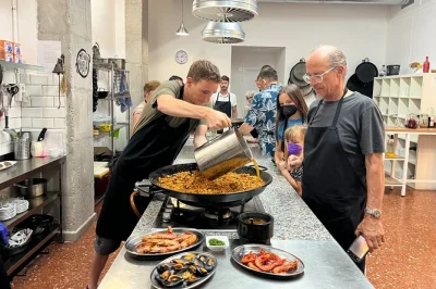 Start at valencia’s ruzafa market, shop for fresh seafood, then cook paella with local chefs. includes tapas, sangria workshop, and a relaxed lunch together.