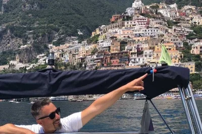 Feel the sea breeze on a private amalfi coast boat tour, swim in hidden coves, explore praiano, and enjoy seaside lunch options. includes drinks and snacks.