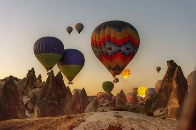 Feel the quiet thrill of a sunrise hot air balloon ride above cappadocia’s valleys, with hotel pickup, local pilot, and post-flight celebration included.