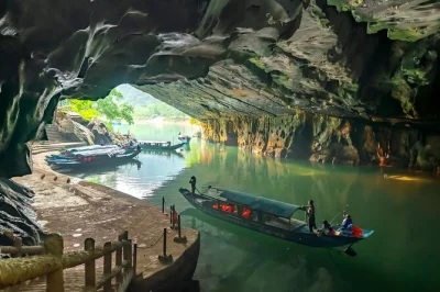 Step into vietnam’s underground world with a local guide, cruise the son river by dragon boat, and explore phong nha & paradise cave. includes pickup & lunch.