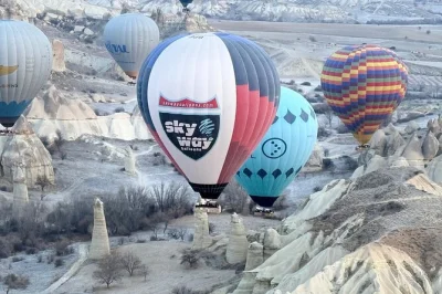 Float above cappadocia’s fairy chimneys at sunrise, watch the crew prep your balloon, and toast with champagne after landing. includes hotel pickup and flight certificate.