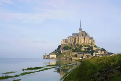 Step onto mont saint-michel’s ancient stones, explore the abbey with a guide, and wander the village lanes. includes pickup from bayeux and entry fees.