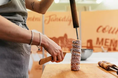 Try your hand at baking kürtőskalács in budapest’s cozy downtown shop. make 3 chimney cakes, learn from locals, and enjoy coffee after your class. includes all materials.