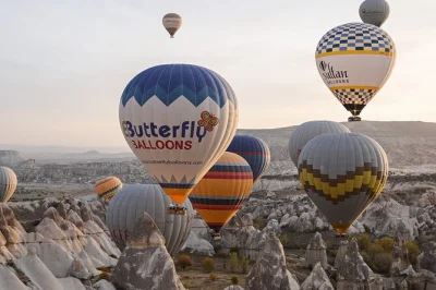 Float above cappadocia’s surreal valleys on a sunrise hot air balloon ride, with hotel pickup, experienced pilots, and a little post-flight celebration included.