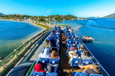 Feel the rhythm of florianopolis on a city tour by open-top bus—beaches, markets, bridge crossing, and local stories. includes guide and flexible pickup.
