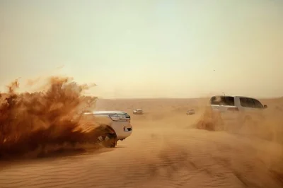 Feel the rush of dune bashing, ride camels at sunset, and enjoy a vip bbq dinner with live shows in abu dhabi’s desert. includes pickup and all activities.