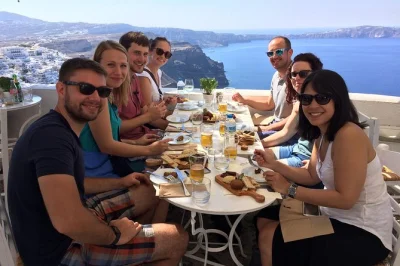 Start your santorini food tour in firostefani, walk the caldera path to fira, sample meze, souvlaki, sweets, and local beer. includes all tastings and a local guide.