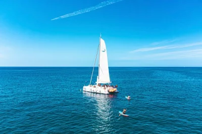 Feel the atlantic breeze on a small-group gran canaria boat tour, swim at wild beaches, enjoy local paella & drinks, and relax with pickup included.
