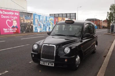 Step into belfast’s history in a classic black taxi, see the shankill & falls road murals, sign the peace wall, and hear local stories—includes city pickup.