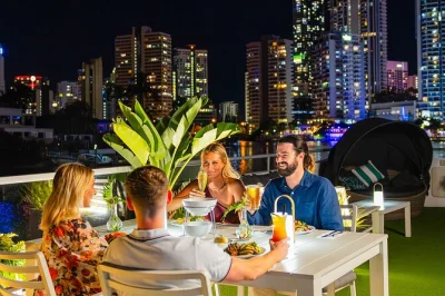 Share laughs over fresh seafood, city lights, and live music on a gold coast dinner cruise. includes buffet dinner, local commentary, and easy parking.